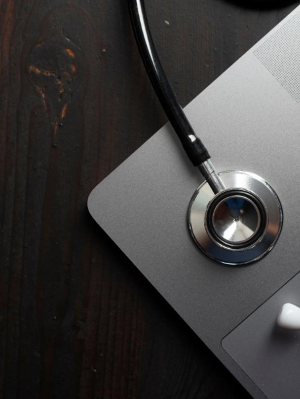 stethoscope on laptop image
