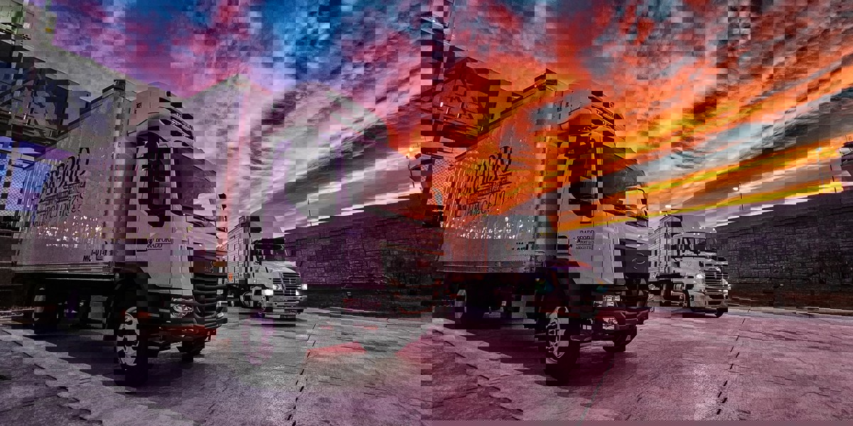 image of trucks at sunset