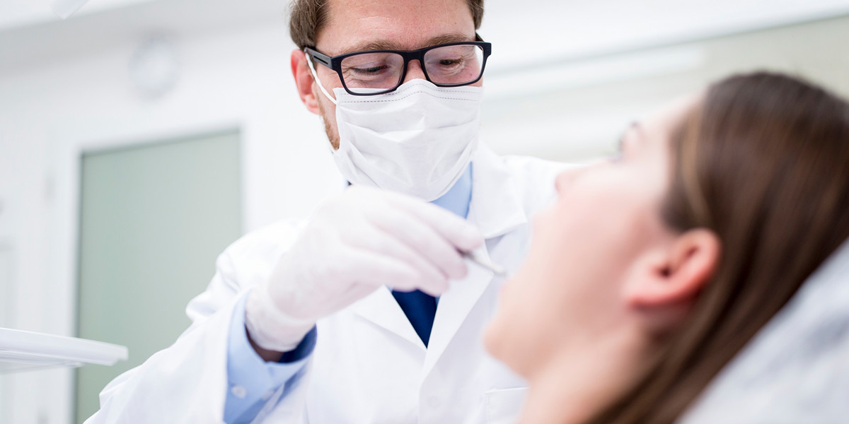 DentalXChange header image dentist working on patient