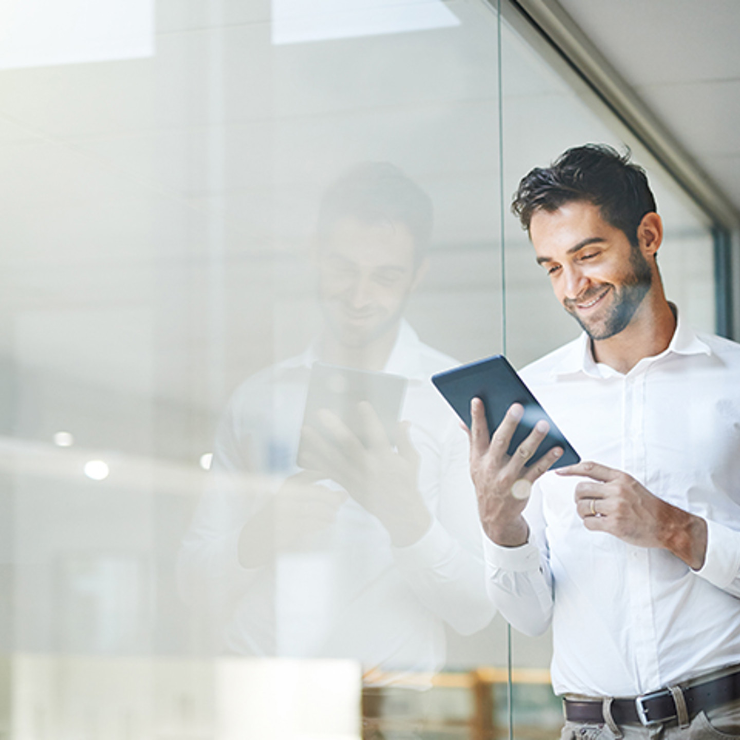 Man looking at tablet image