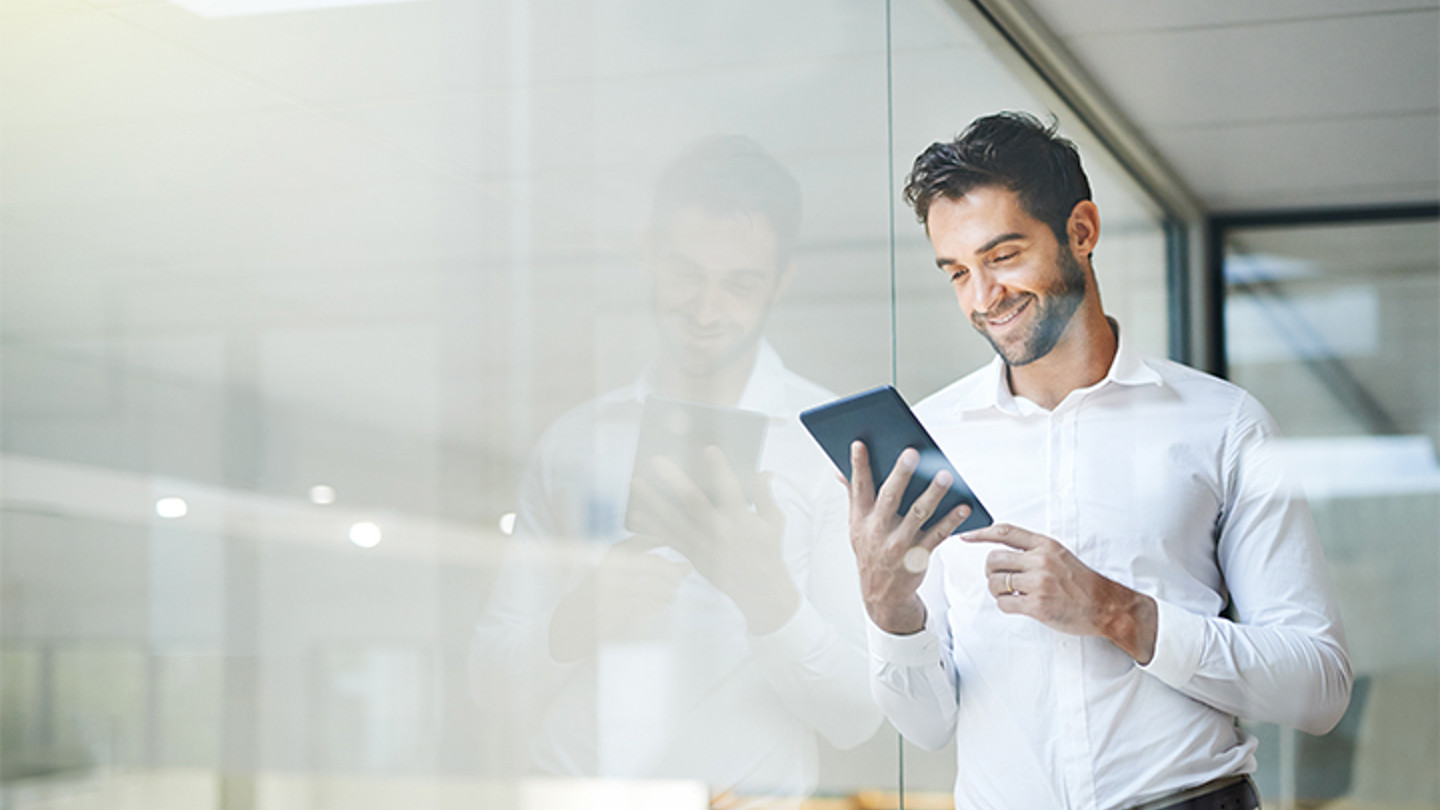 Man looking at tablet image