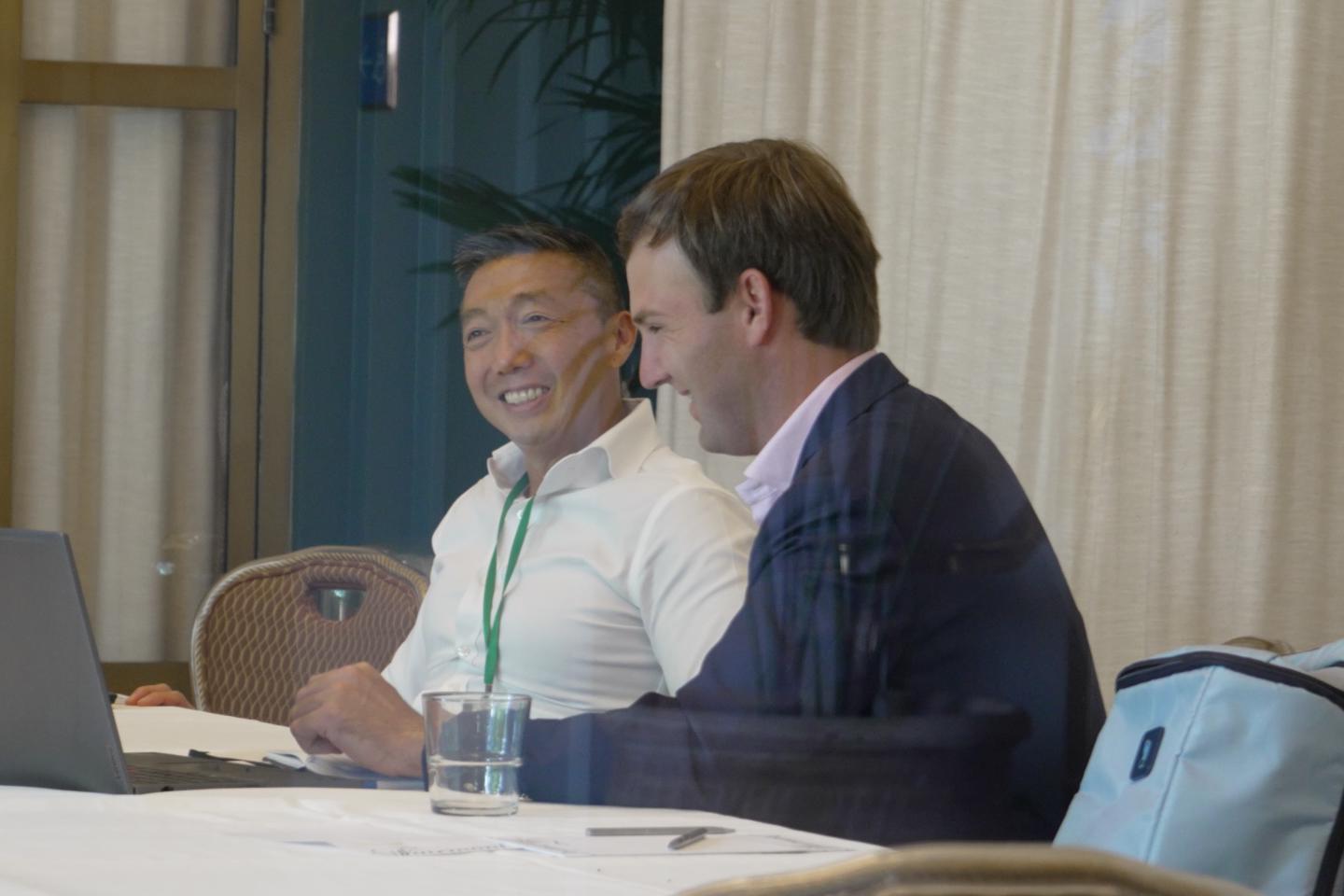 Video still of two people working